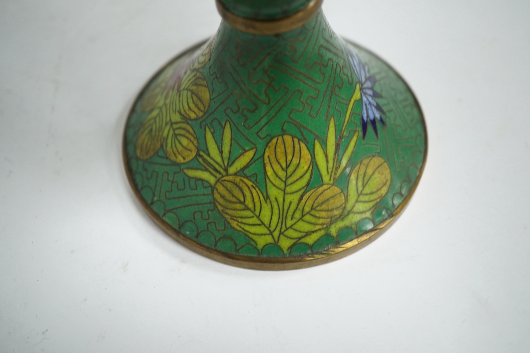 A pair of Chinese champleve enamel floral jars and covers, 22cm high. Condition - good